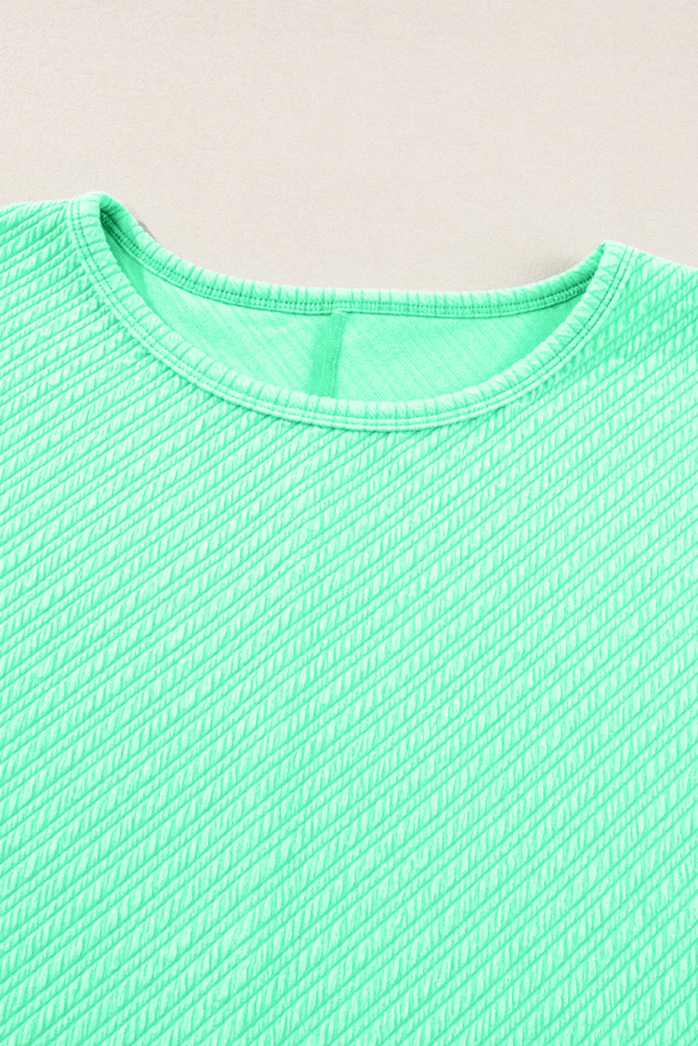 Mintgroene getextureerde T-shirt met wijde pijpen, grote maten set