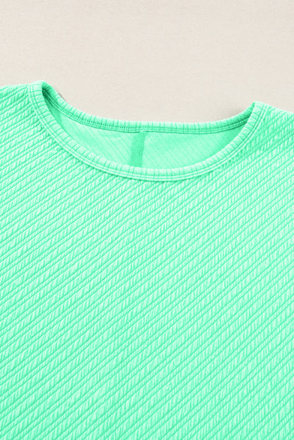 Mintgroene getextureerde T-shirt met wijde pijpen, grote maten set