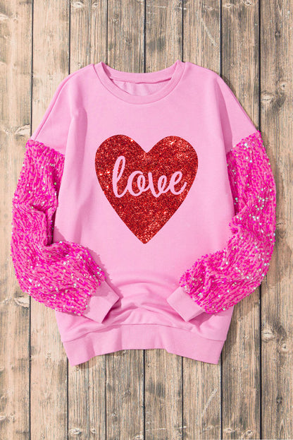 Roze glanzend hartvormig sweatshirt met liefdesprint en lovertjes op de mouwen