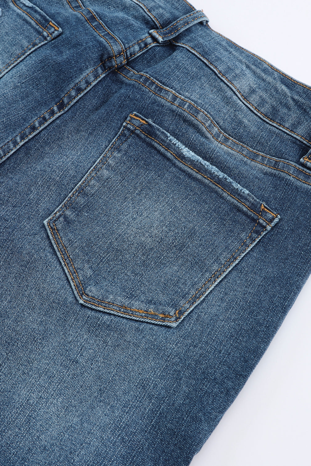 Blauwe noodlijdende skinny jeans met hoge taille en knoopsluiting