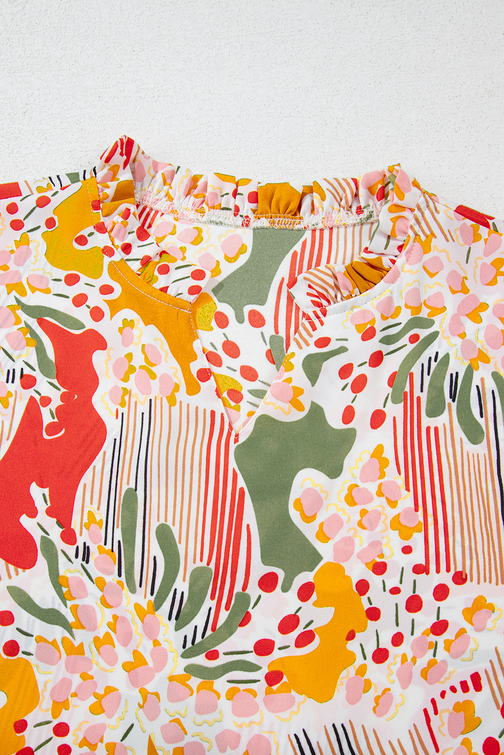 Oranje bedrukte bloemen-abstracte print met ruches en V-hals, grote maat blouse