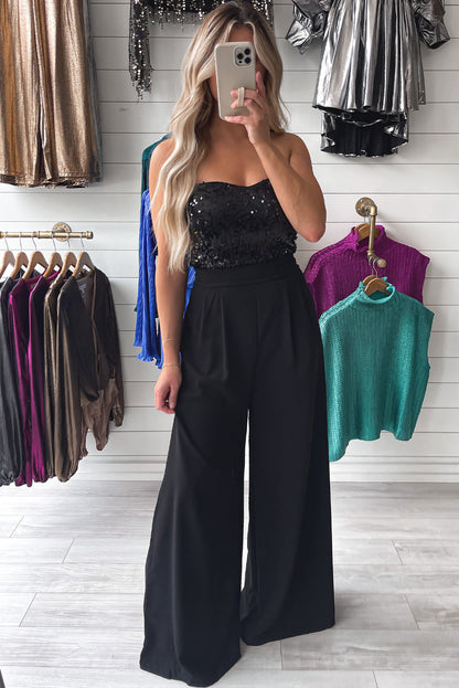 Zwarte jumpsuit met pailletten en wijde pijpen