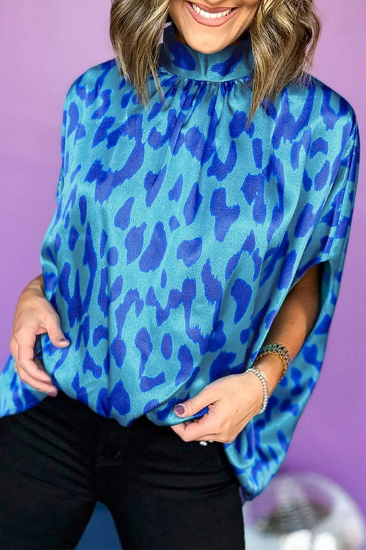 Blauwe kaftan top met dierenprint en nephalsdetail