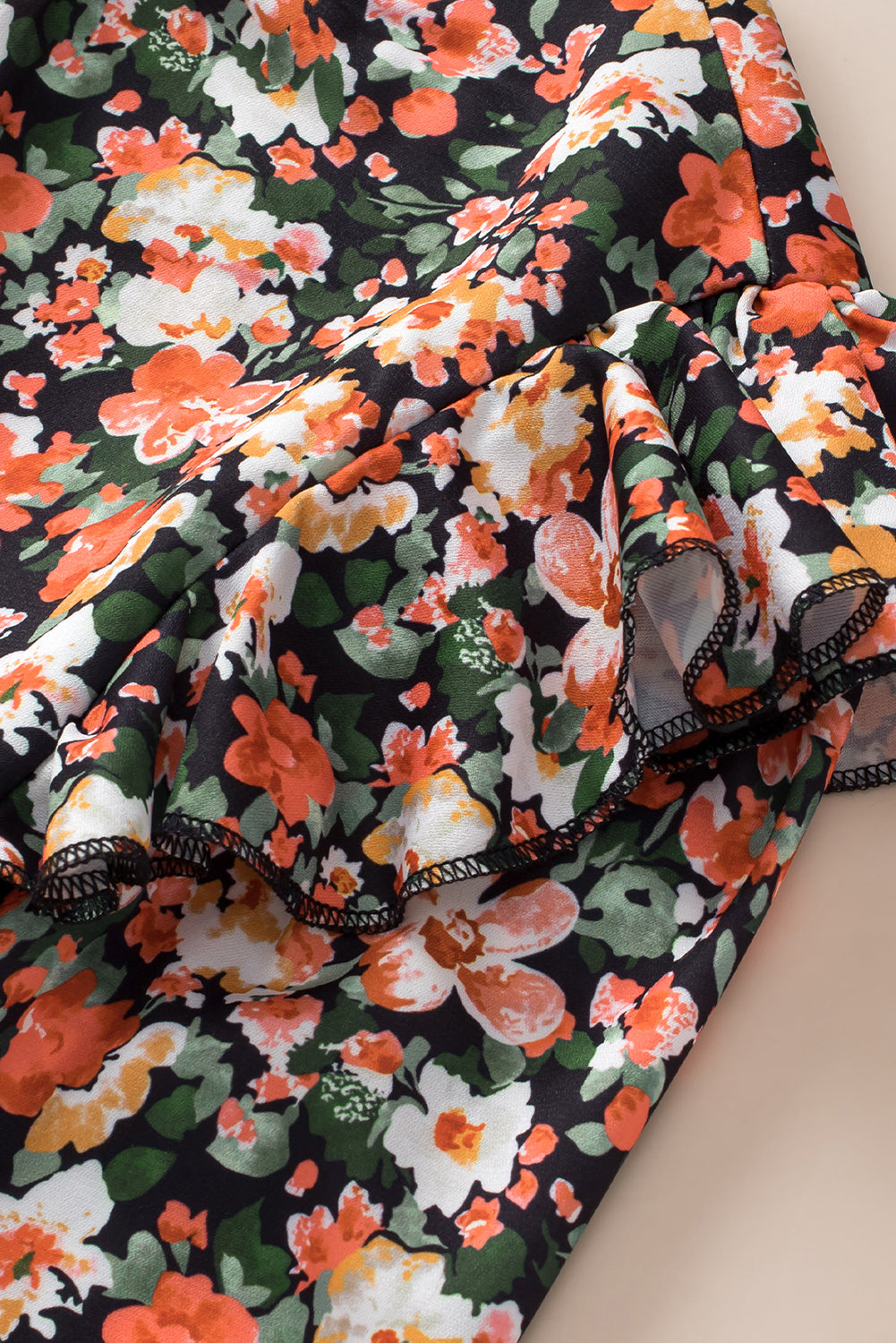 Oranje blouse met ruches, gesmokte manchetten en bloemen