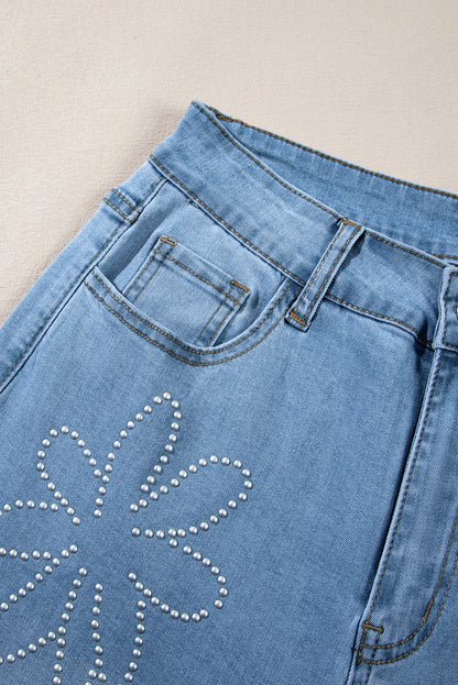 Lichtblauwe jeans met bloemen en strassdecor, hoge taille en wijde pijpen