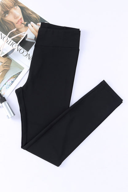 Zwarte legging met gekruiste buikcontrole en hoge taille