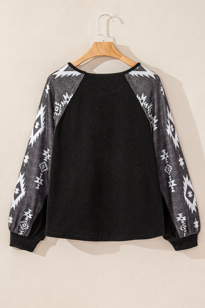 Zwarte top met lange mouwen en westerse print