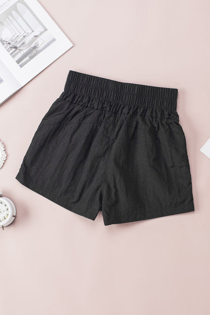 Zwarte elastische short met hoge taille en zijzakken