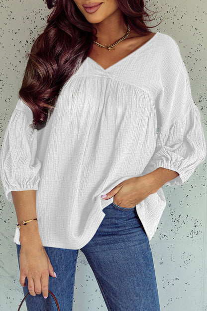 Witte getextureerde babydollblouse met V-hals en armbandmouwen