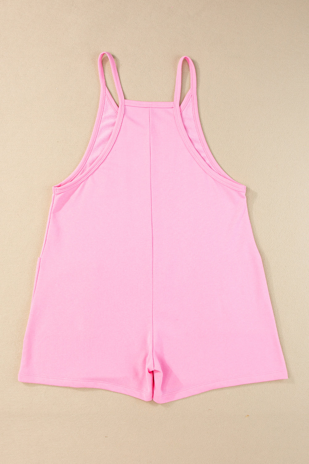 Roze mouwloze jersey romper met V-hals en zakken