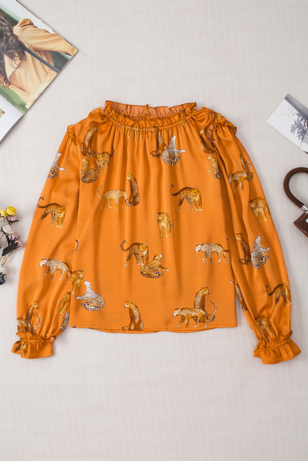 Oranje blouse met cheetah-print en gegolfde mouwen