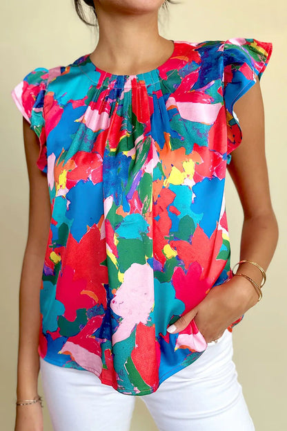 Donkerblauwe blouse met geplooide hals en fladdermouwen met abstracte print