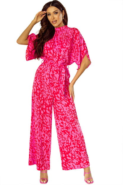 Roze luipaard jumpsuit met wijde pijpen, losse mouwen en riem