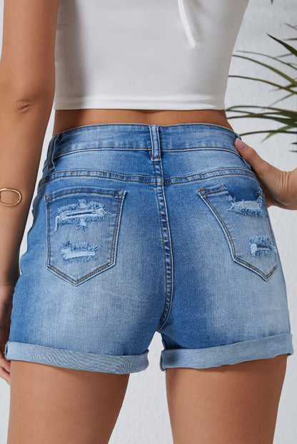 Hemelsblauwe vintage noodlijdende denim shorts met hoge taille en zakken