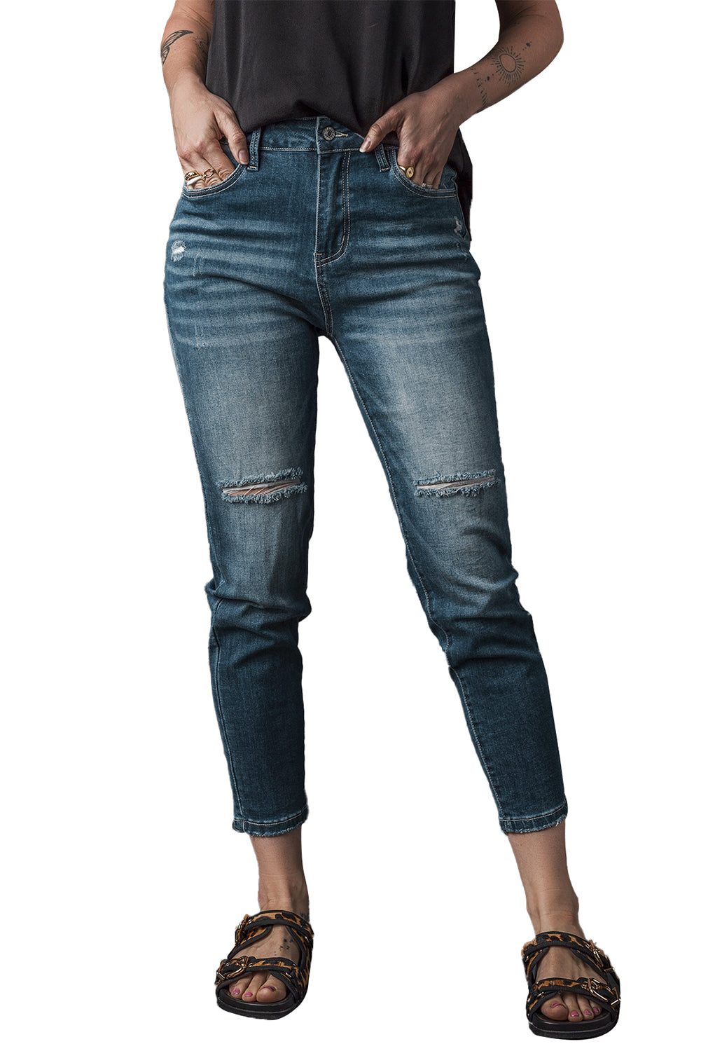 Blauwe noodlijdende gescheurde skinny jeans