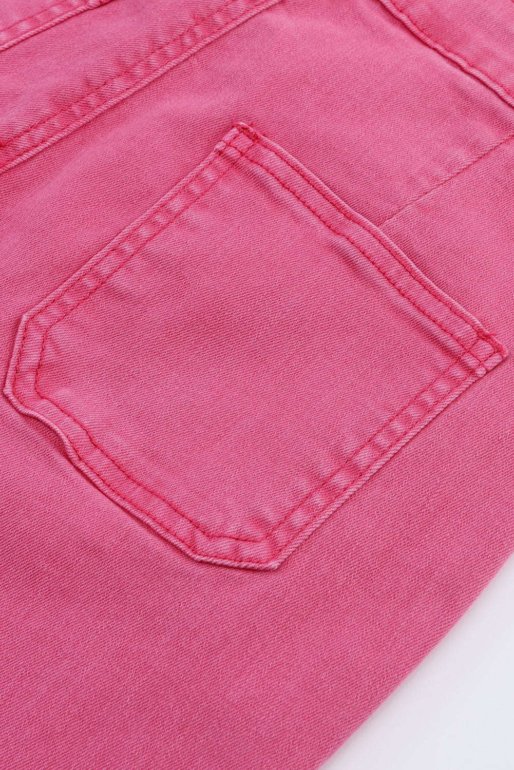 Roze enkellange jeans met uitlopende pijpen en ruwe zoom