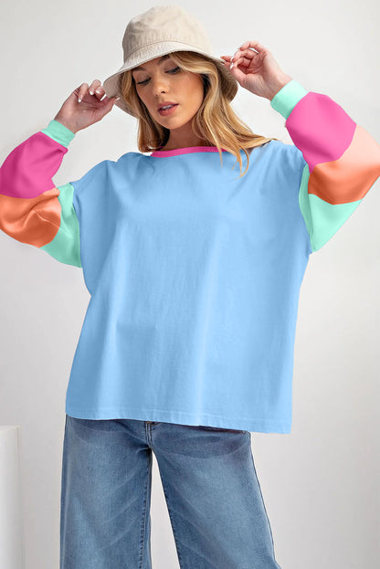 Donkerblauwe losvallende top met colorblock-patchwork en lange mouwen