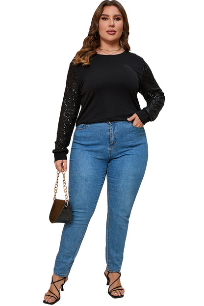 Zwarte plus-size top met contrasterende pailletten en lange mouwen