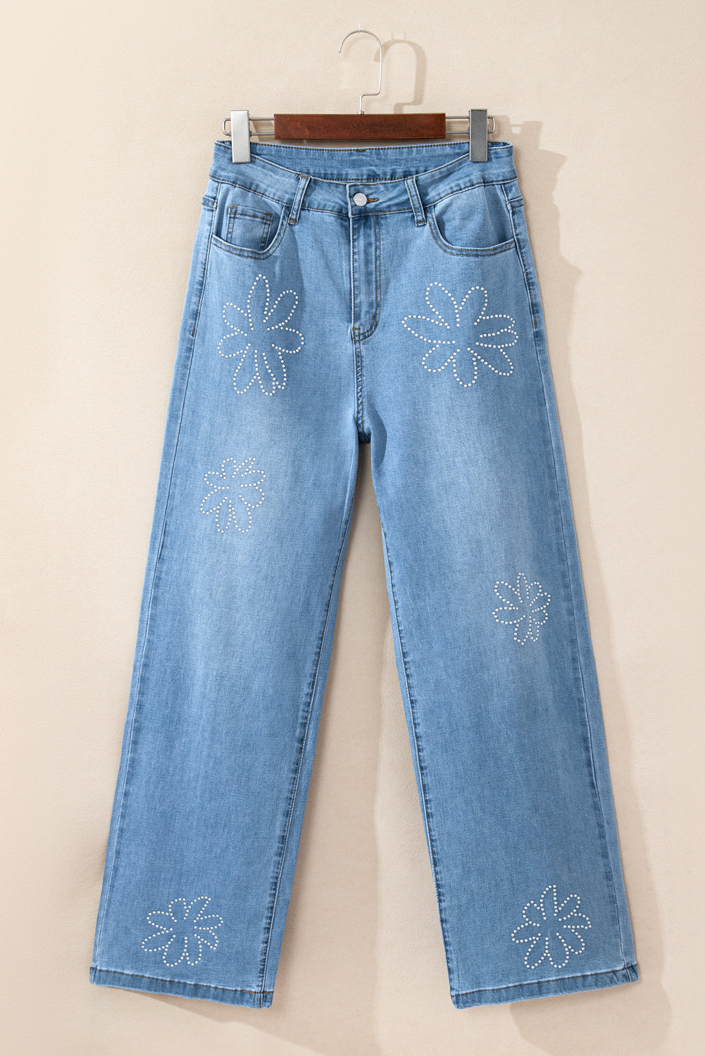 Lichtblauwe jeans met bloemen en strassdecor, hoge taille en wijde pijpen