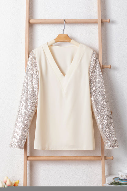 Witte blouse met pailletten en patchwork met V-hals