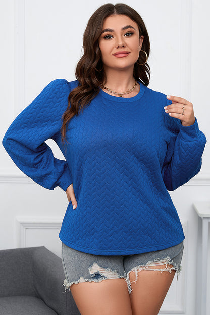 Donkerblauwe plus-size top met kabelpatroon en pofmouwen