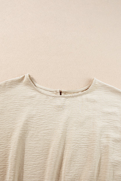 Beige gekreukelde crop-T-shirt met elastische zoom en broek met wijde pijpen