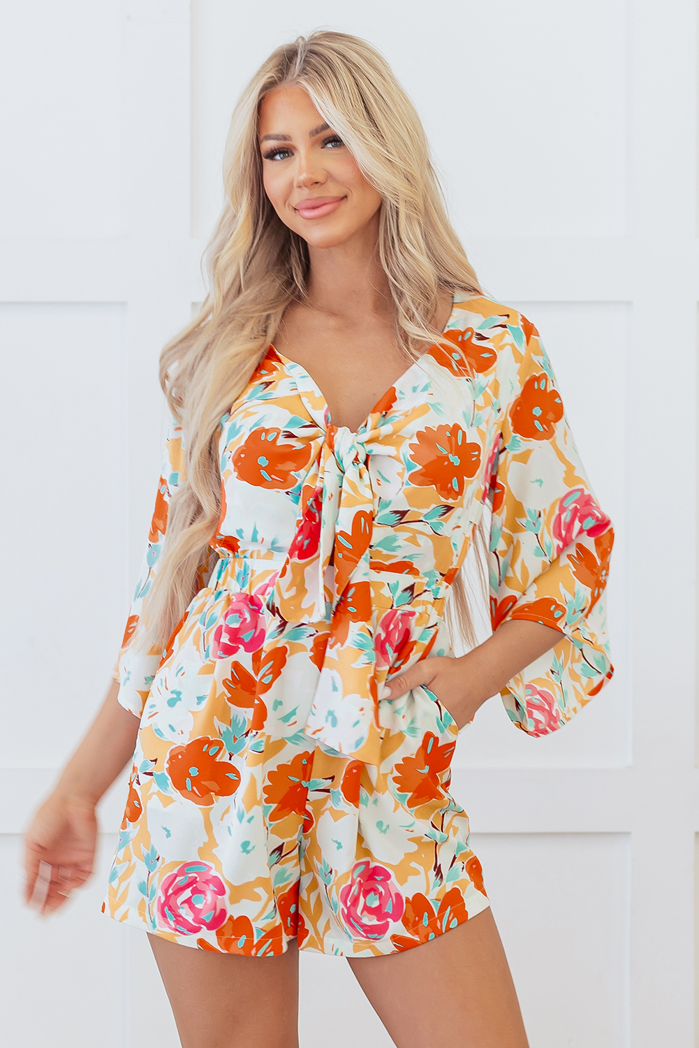 Oranje bloeiende bloemenprint front tie romper