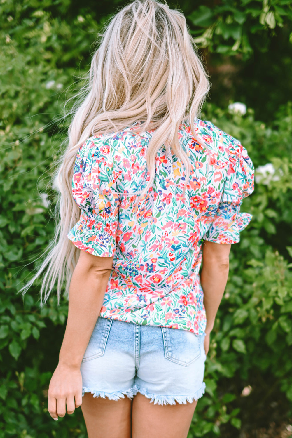 Roze bloemenprint blouse met splithals en pofmouwen