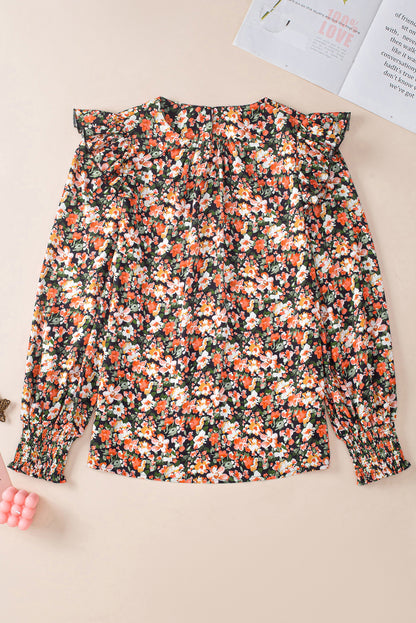 Oranje blouse met ruches, gesmokte manchetten en bloemen