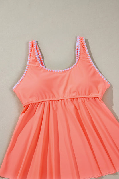 Tankini-badpak met frisse zalm en contrasterende rand met ruches en peplum-top