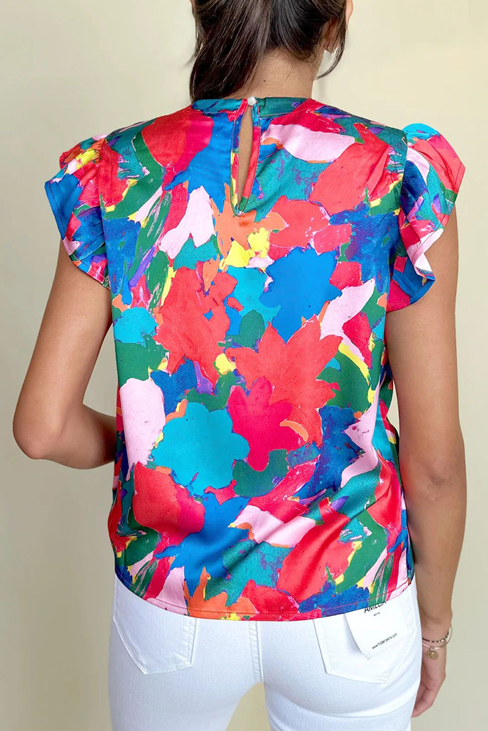 Donkerblauwe blouse met geplooide hals en fladdermouwen met abstracte print