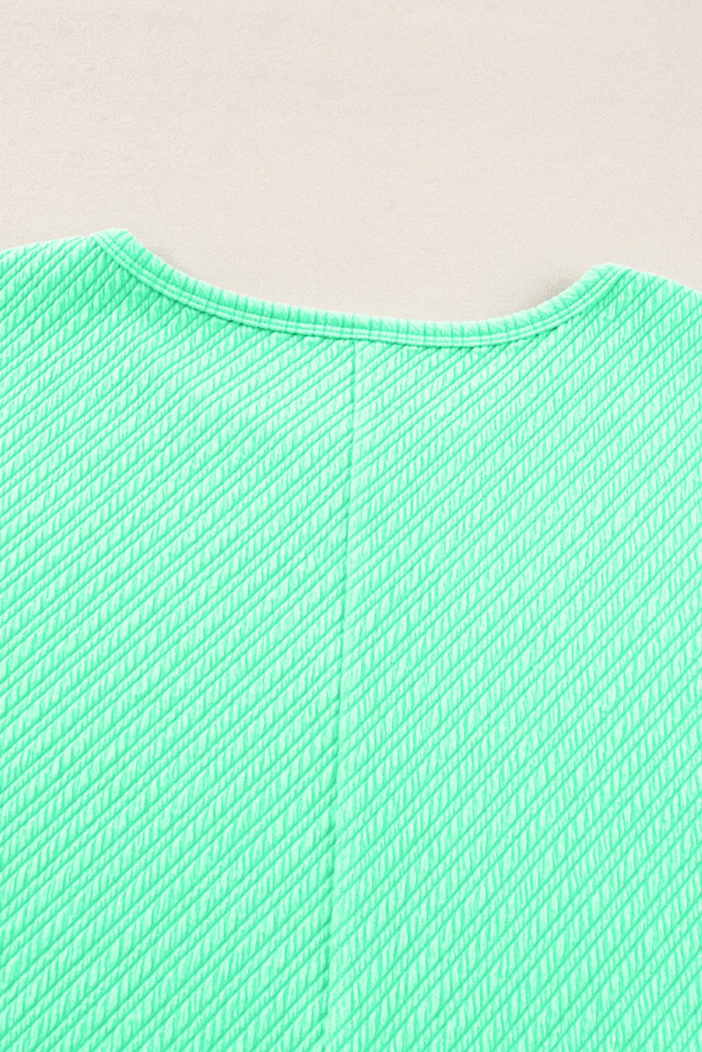 Mintgroene getextureerde T-shirt met wijde pijpen, grote maten set