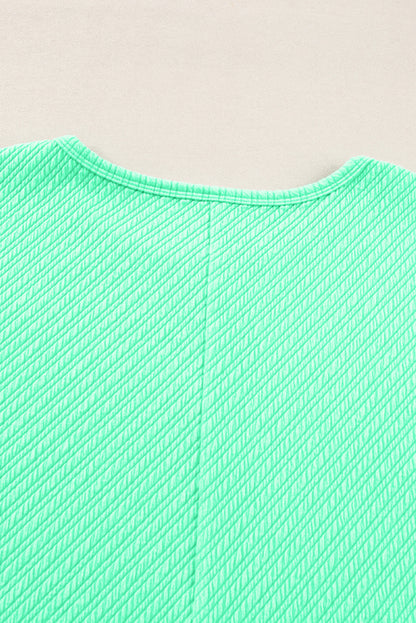 Mintgroene getextureerde T-shirt met wijde pijpen, grote maten set