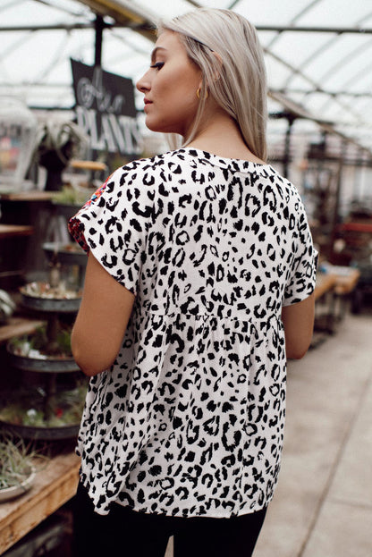 Blouse met luipaardmix en kwastjes