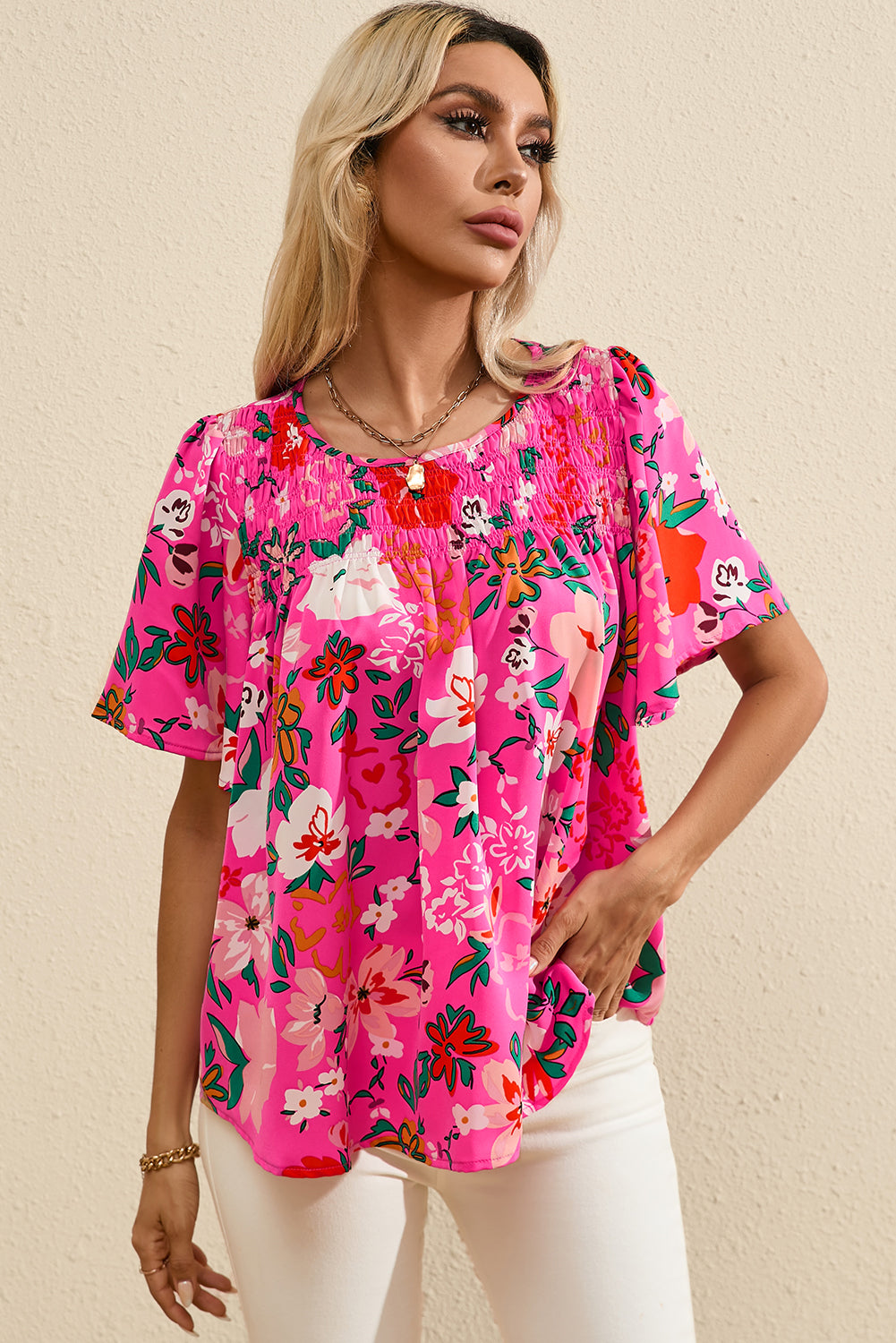 Roze gebloemde gesmokte blouse met korte mouwen