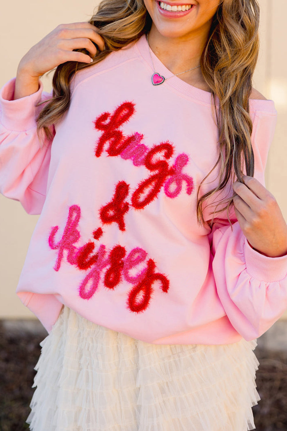 Roze knuffels en kusjes pop -up geborduurd raglan mouw sweatshirt