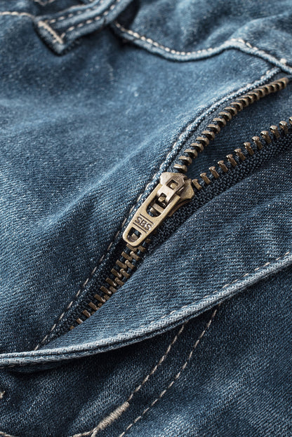 Blauwe noodlijdende gescheurde skinny jeans