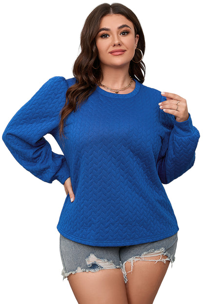 Donkerblauwe plus-size top met kabelpatroon en pofmouwen