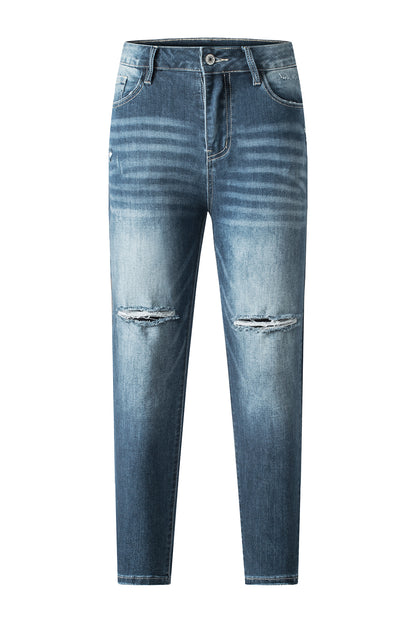 Blauwe noodlijdende gescheurde skinny jeans