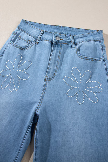 Lichtblauwe jeans met bloemen en strassdecor, hoge taille en wijde pijpen