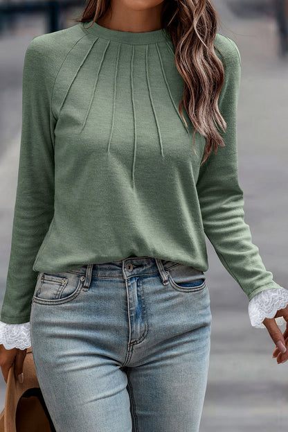 Grasgroene naad details kanten contrast manchetten raglan mouw top