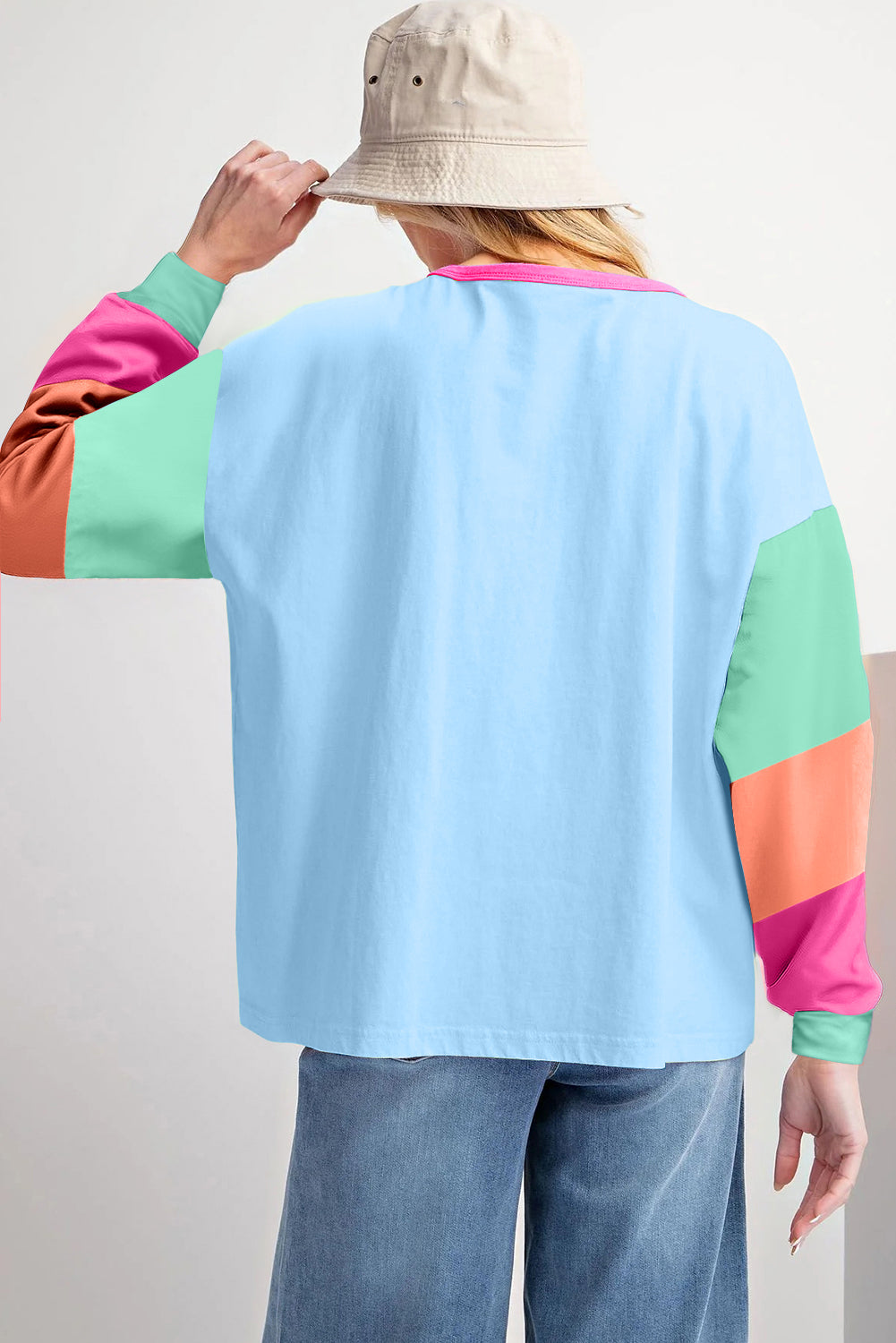 Donkerblauwe losvallende top met colorblock-patchwork en lange mouwen