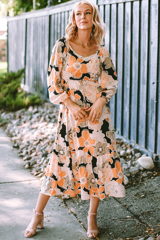 Maxi-jurk met gestrikte taille, pofmouwen en gedurfde bloemen