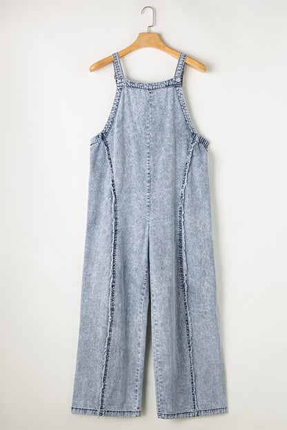 Beau Blue Light Wash Gerafelde denim overall met zichtbare naden en wijde pijpen