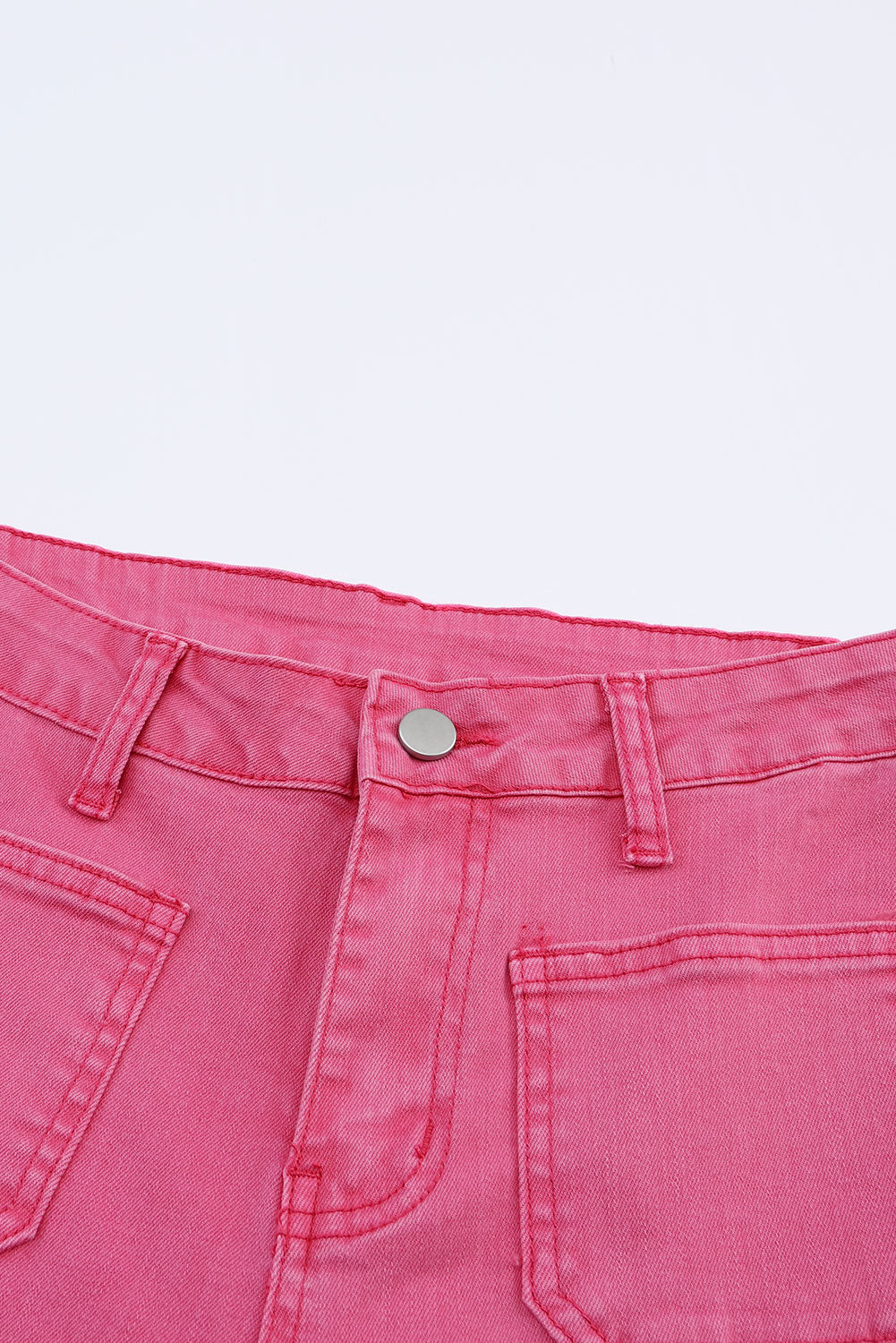 Roze enkellange jeans met uitlopende pijpen en ruwe zoom