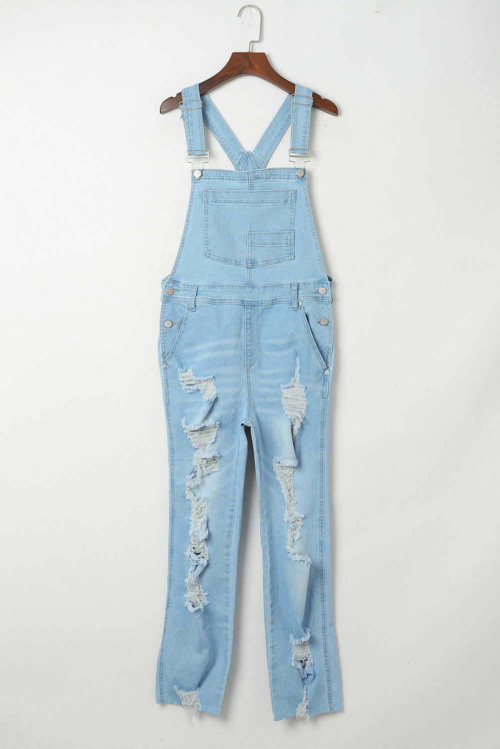 Hemelsblauw geconstrueerde noodlijdende denim overall met borstzak