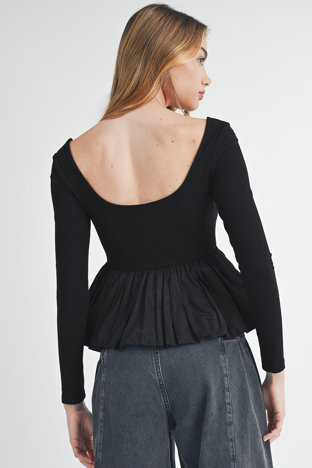 Black geribbeld gebreide schep met lange mouwen Peplum patchwork top