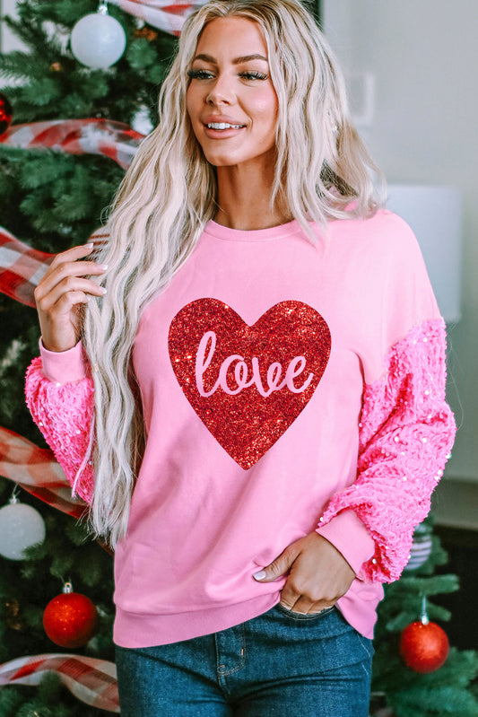 Roze glanzend hartvormig sweatshirt met liefdesprint en lovertjes op de mouwen