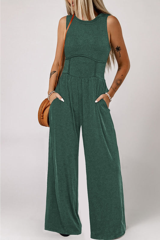 Zwartachtig groene mouwloze jumpsuit met wijde pijpen en geplooide taille