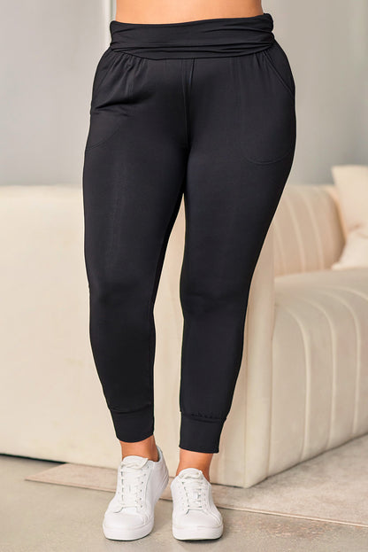 Zwarte plus-size skinny broek met hoge taille en zakken